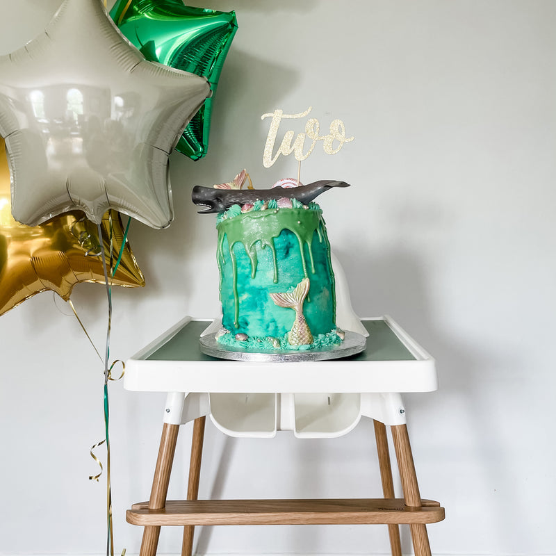 ikea highchair glow up for baby's second birthday cake with balloons