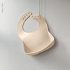 Silicone waterproof Bib with deep scoop to catch food whilst weaning, cream colour from the UK