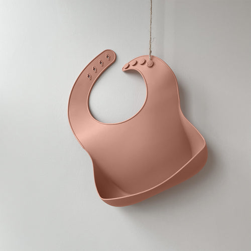 Silicone waterproof Bib with deep scoop to catch food whilst weaning, pink colour from the UK